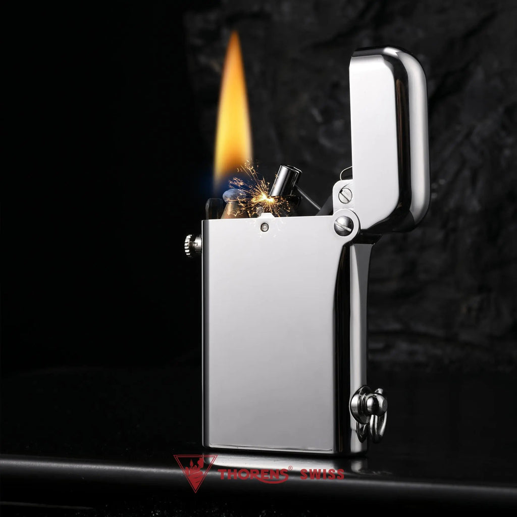 A Thorens Gen 2 Double Claw glossy silver lighter ignited with a brilliant flame and sparks, highlighting its mechanical precision against a dark background.
