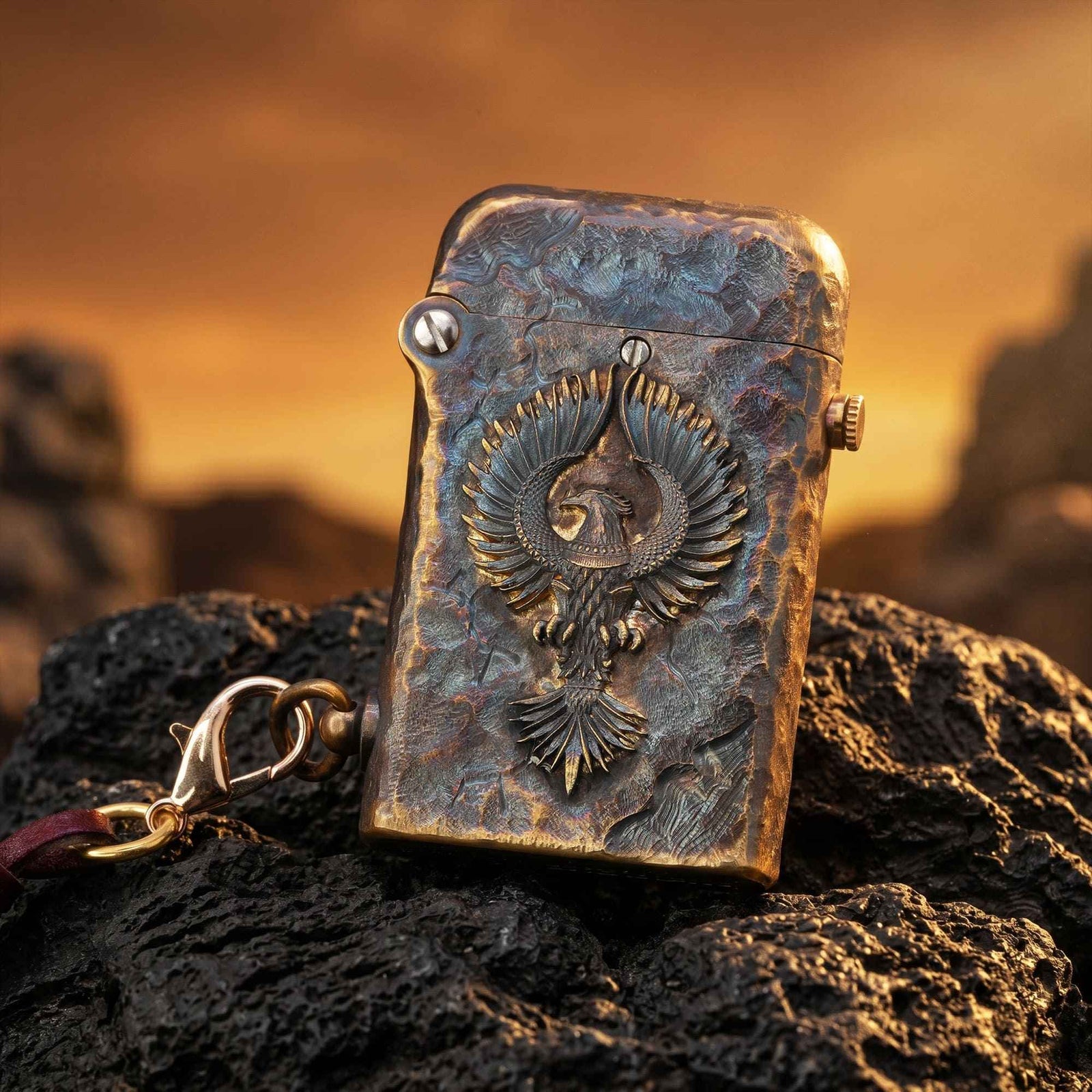 Thorens Gen 2 Double Claw Imperial Eagle lighter shown with the lid down, highlighting the raised eagle emblem, distressed brass finish, and side chain detail.