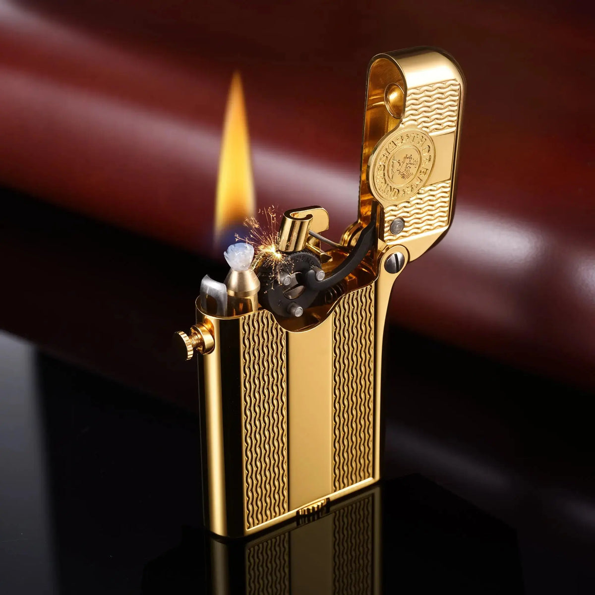 A gold-plated Thorens Gen 3 single claw lighter featuring a spaced water ripple pattern engraving, standing upright on a chessboard.