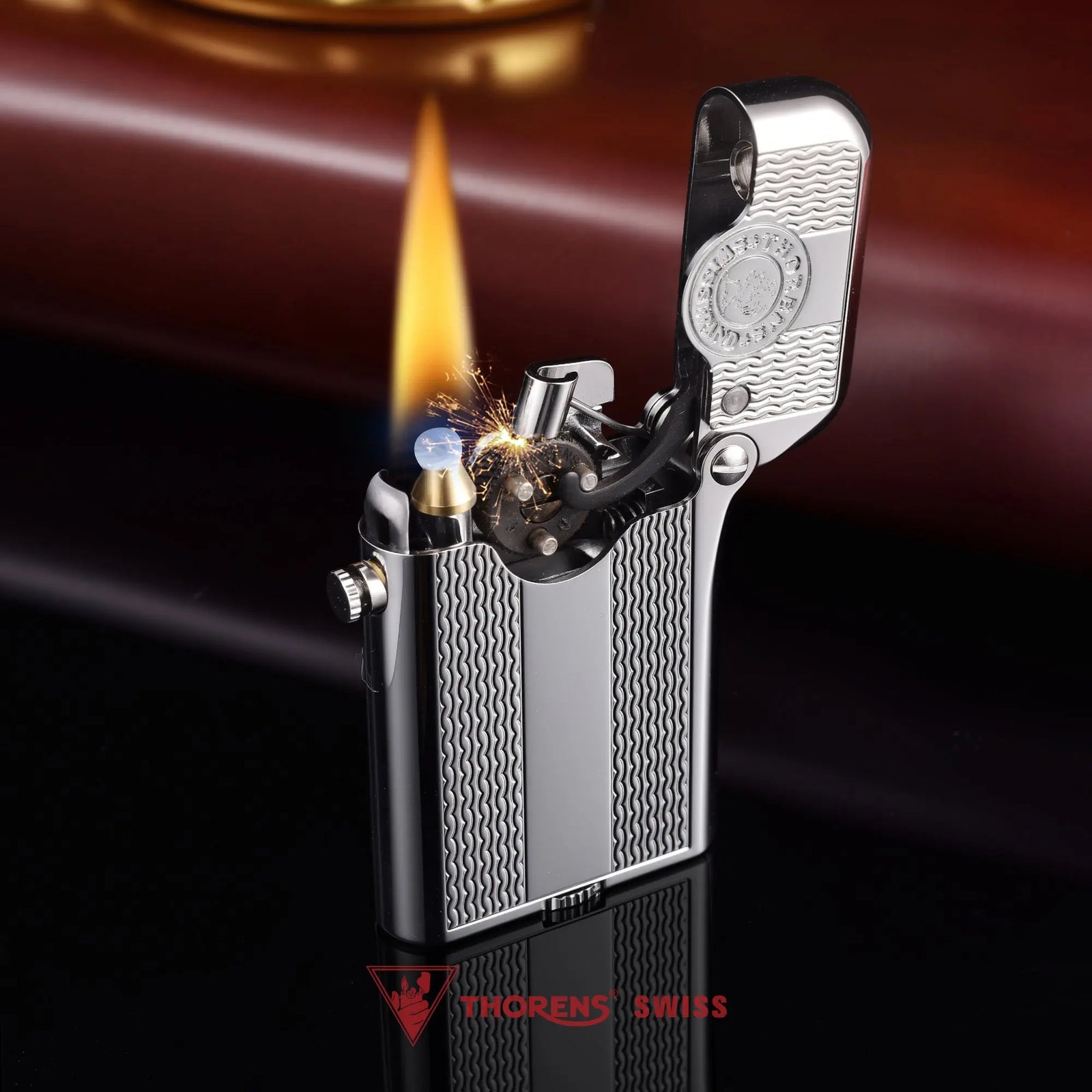 Side view of an open silver Thorens Gen 3 lighter, highlighting the single claw mechanism, internal medallion, and the precision-milled water ripple pattern.