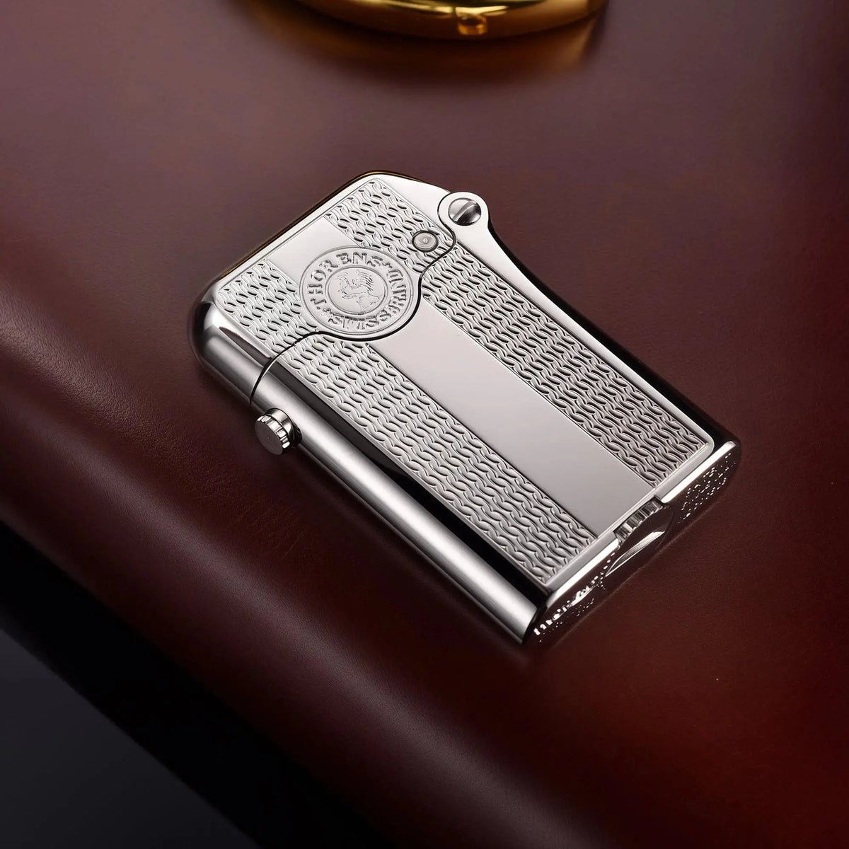 An ignited silver Thorens Gen 3 lighter with a spaced water ripple pattern, showing the single claw mechanical action, sparks, and flame against a dark chessboard background.