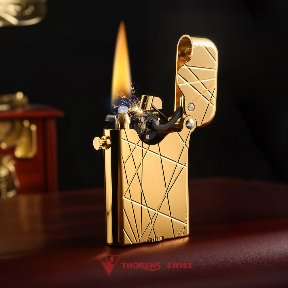 An ignited Thorens Gen 3 Single Claw lighter in gold, showcasing the modern grid engraving and mechanical ignition sparks in a refined lifestyle setting.