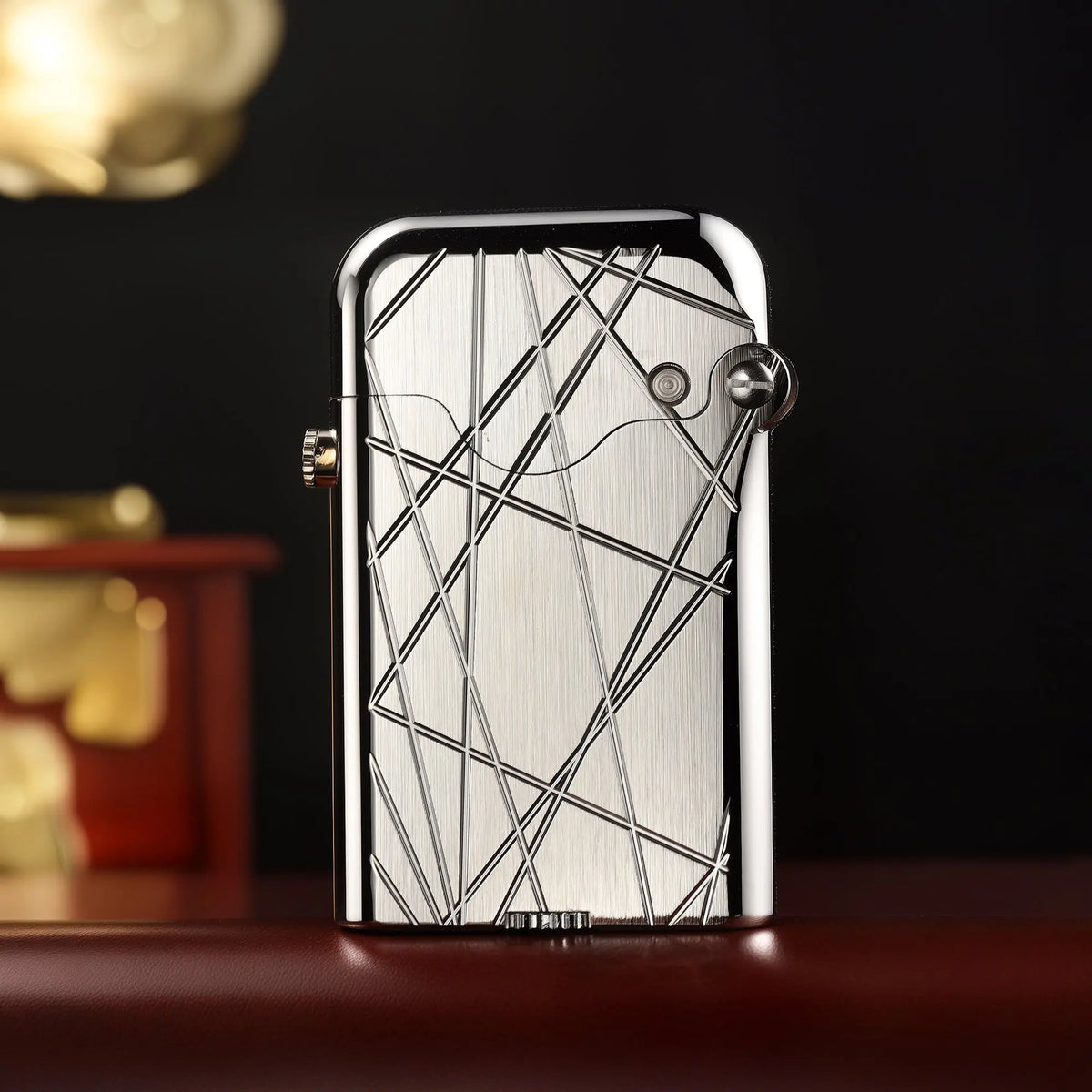 An upright Thorens Gen 3 Single Claw lighter in a brushed silver finish, showcasing its precision mechanical build and modern grid engraving.