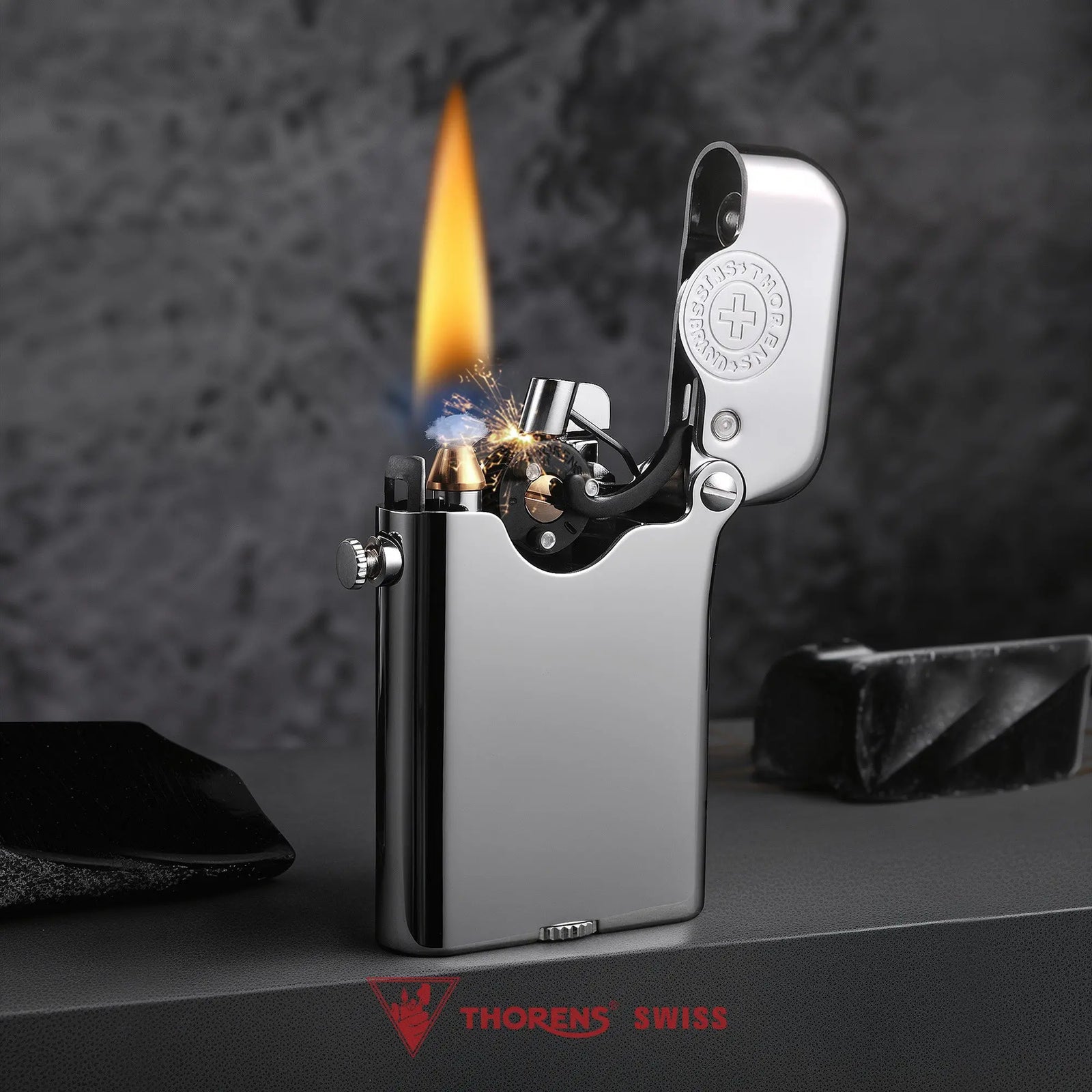 A lit Gen 3 Single Claw silver lighter displaying a warm flame and mechanical sparks, featuring a glossy finish and heritage brand emblem.