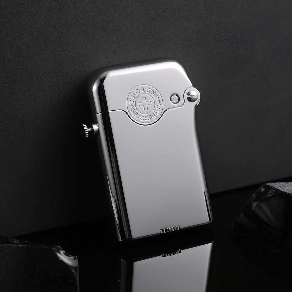 A glossy silver Gen 3 Single Claw lighter with an embossed brand emblem, resting on a reflective surface against a minimalist dark background.