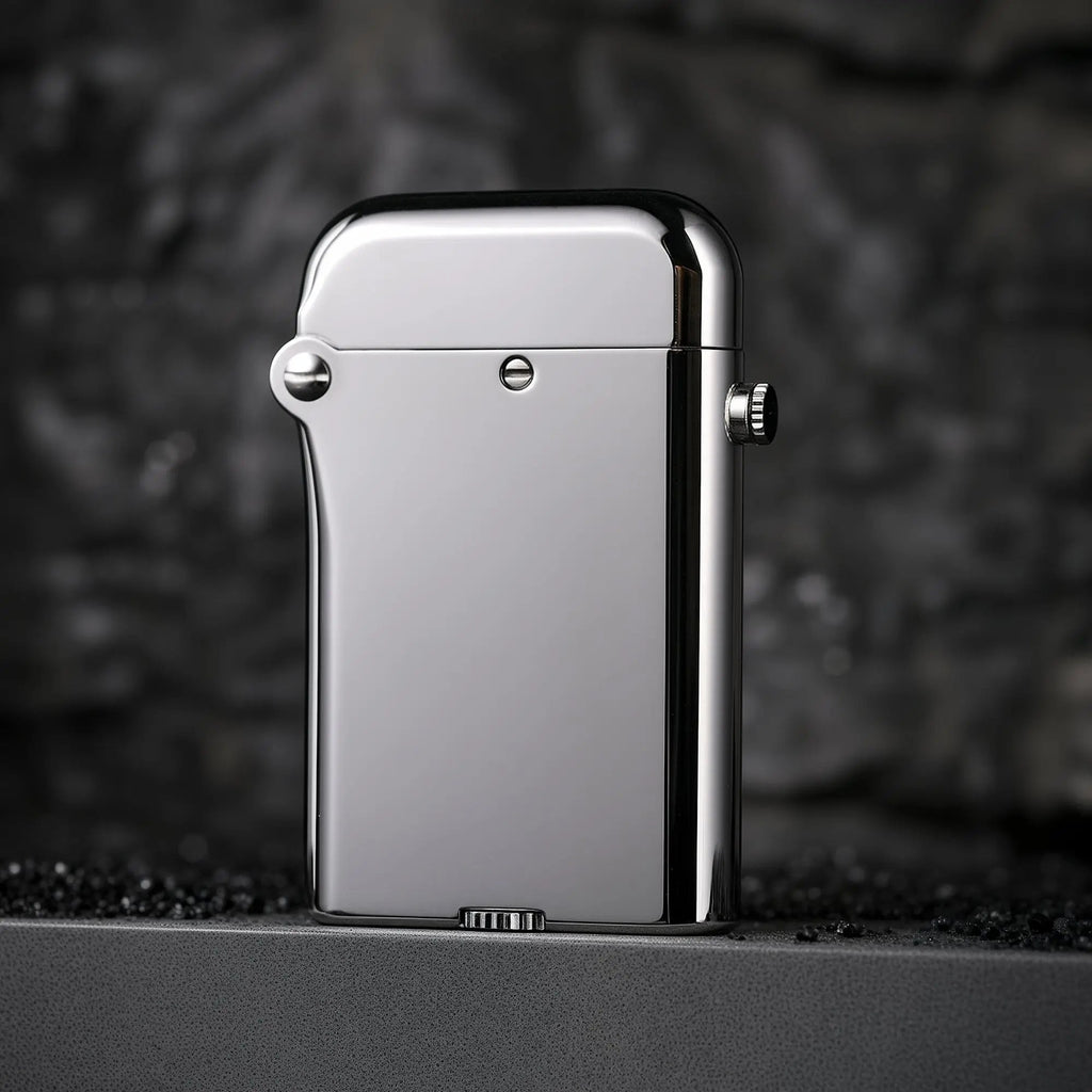 A sleek silver Thorens Gen 4 double claw lighter with a glossy finish, highlighting the bottom-fill mechanical structure and refined industrial design.