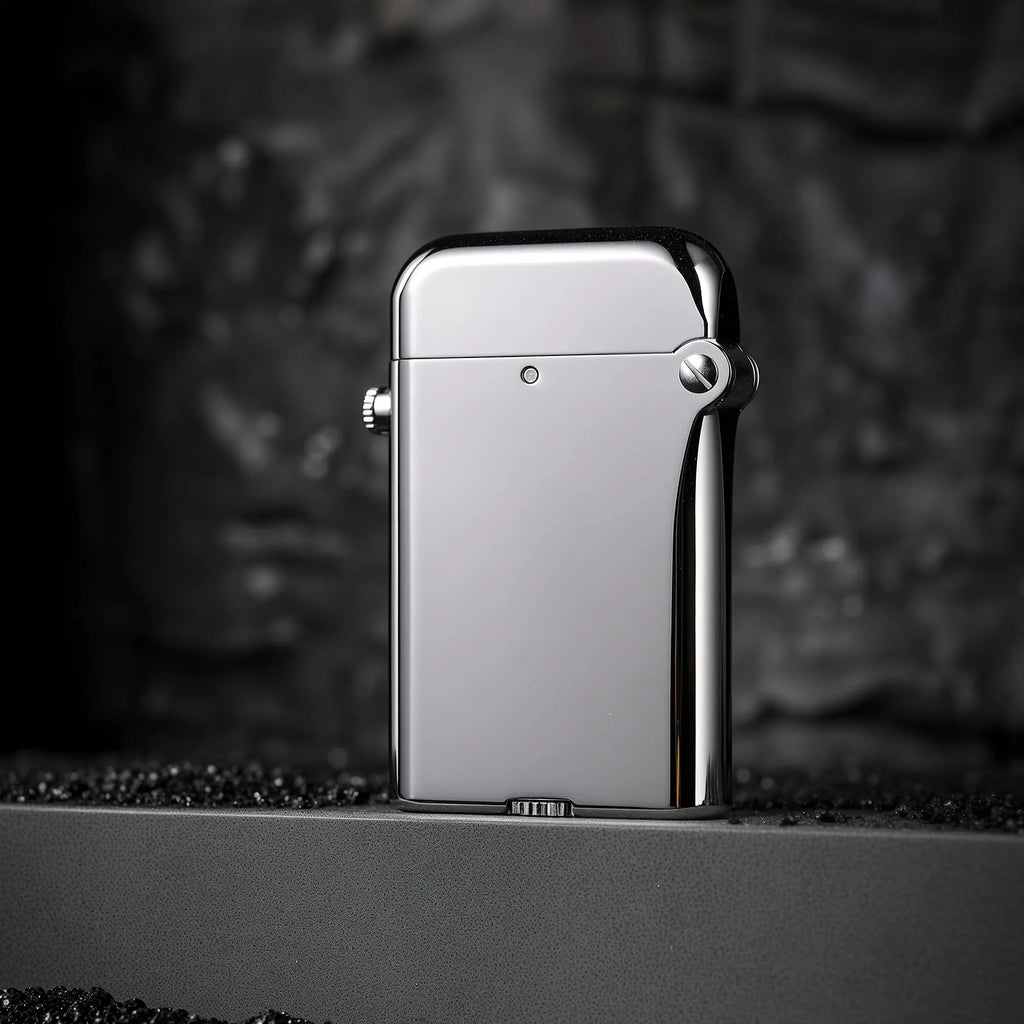 A polished silver Thorens Gen 4 double claw lighter featuring a high-gloss mechanical body and bottom-fill screw design on a textured surface.