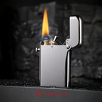 A silver glossy Thorens Gen 4 double claw lighter shown ignited with a steady flame and visible sparks, showcasing its heritage mechanical precision.