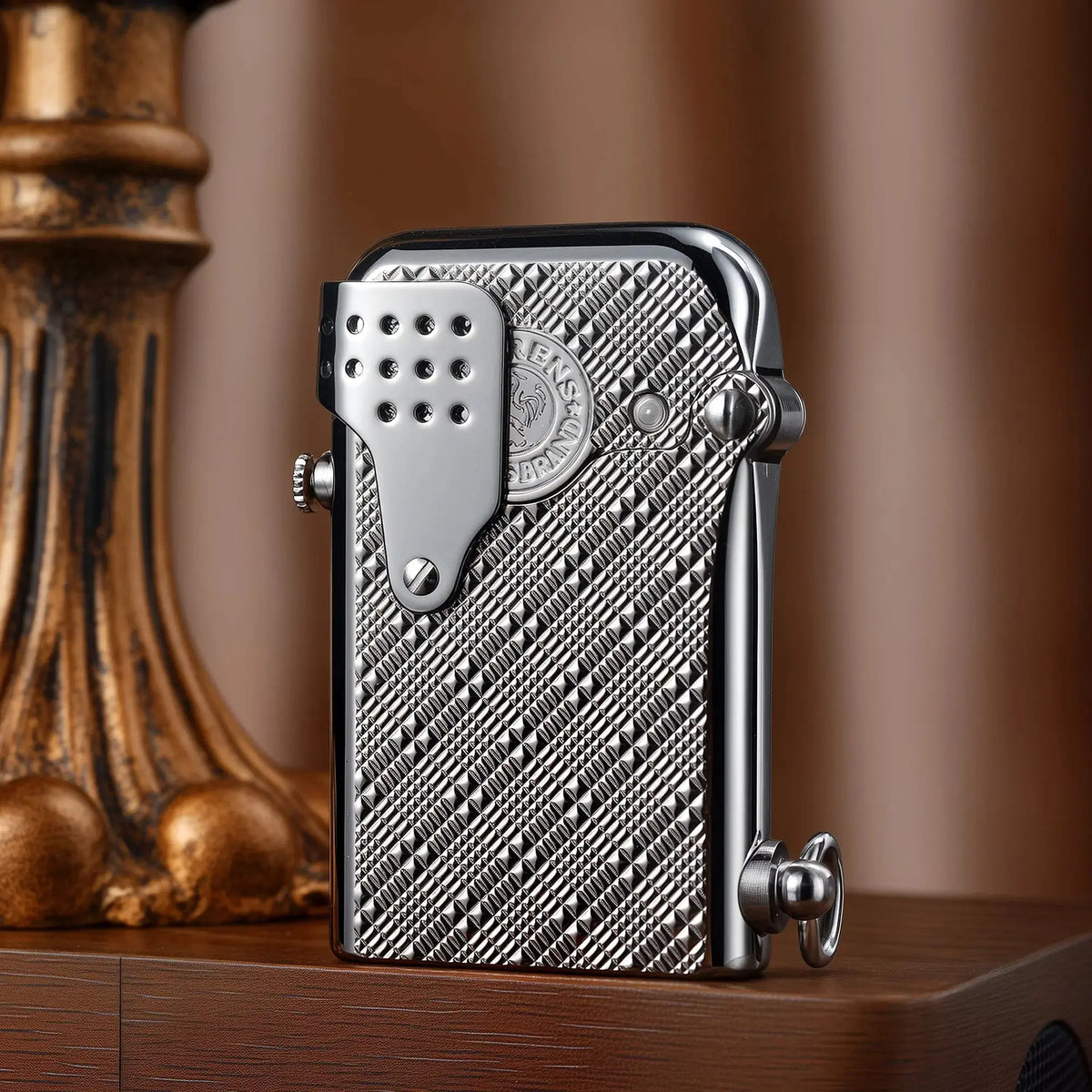 A Thorens Gen 5 Single Claw "STORM" lighter in a polished silver finish, featuring a "Starry Mesh" textured body and a perforated windproof guard, resting on a wooden surface.