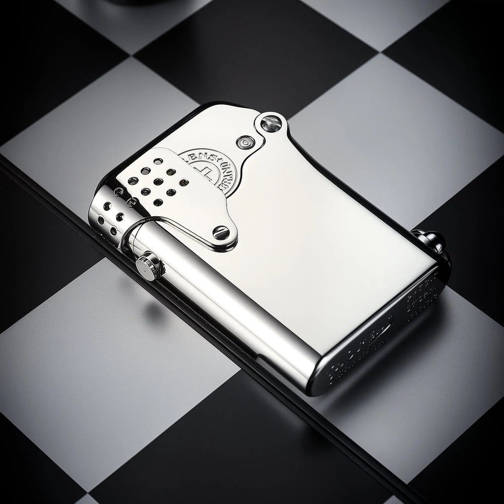 A high-polish silver Gen 5 Single Claw Storm lighter resting on a checkered surface, featuring a side-fill port and perforated wind-guard.