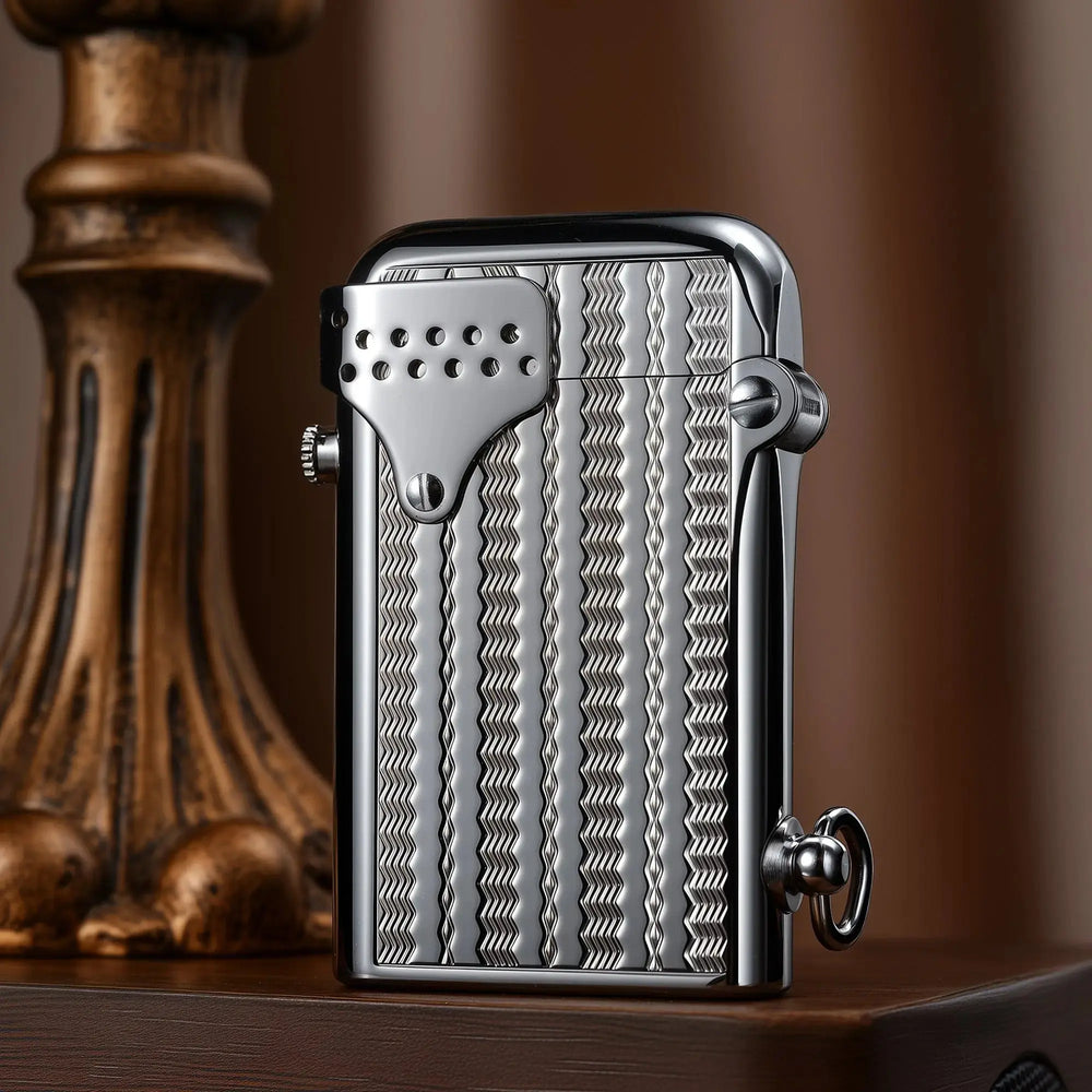 A closed Thorens Gen 6 Double Claw STORM lighter with a polished chrome body, featuring an intricate wave reflection pattern and a classic windproof guard.