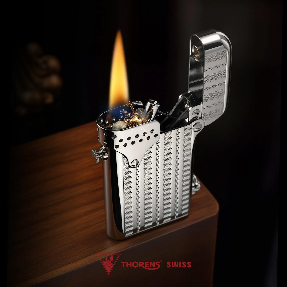 A Thorens Gen 6 Double Claw STORM lighter with an ignited flame, highlighting the polished wave reflection texture and the iconic Swiss brand logo.