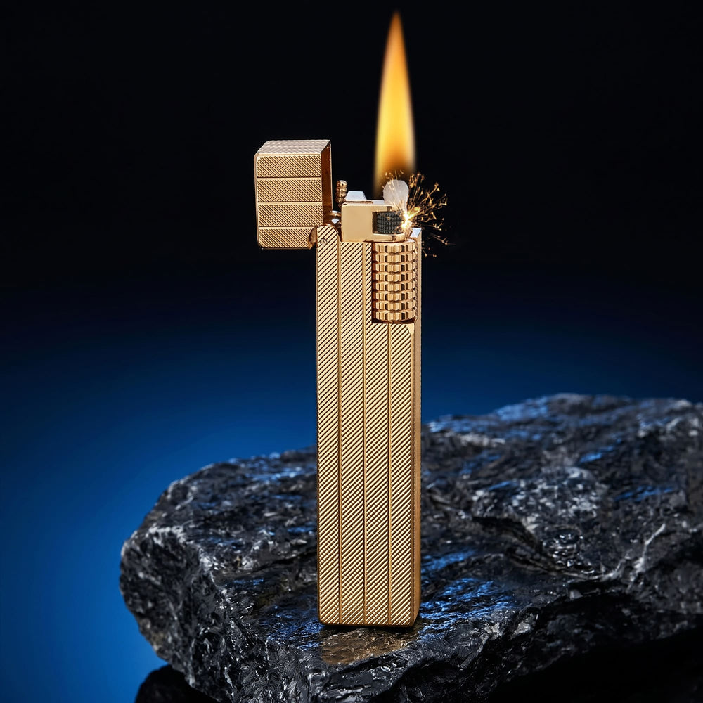 Thorens rectangular lighter with gold diagonal pattern shown open and ignited, highlighting spark, flame, side ignition wheel, and textured surface pattern.