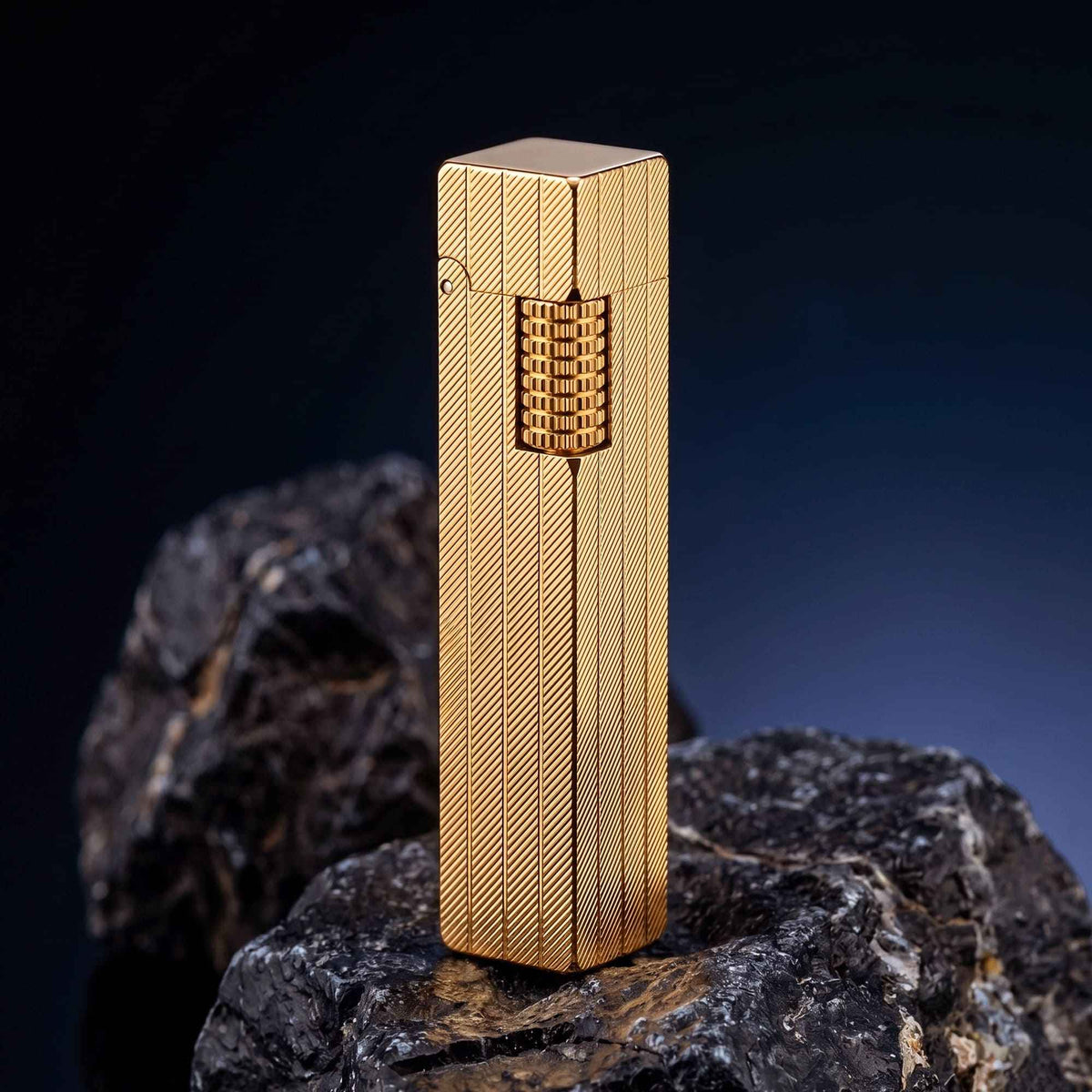Thorens rectangular lighter with gold diagonal pattern shown with the lid down, highlighting the slim body shape, surface pattern, and side ignition wheel.