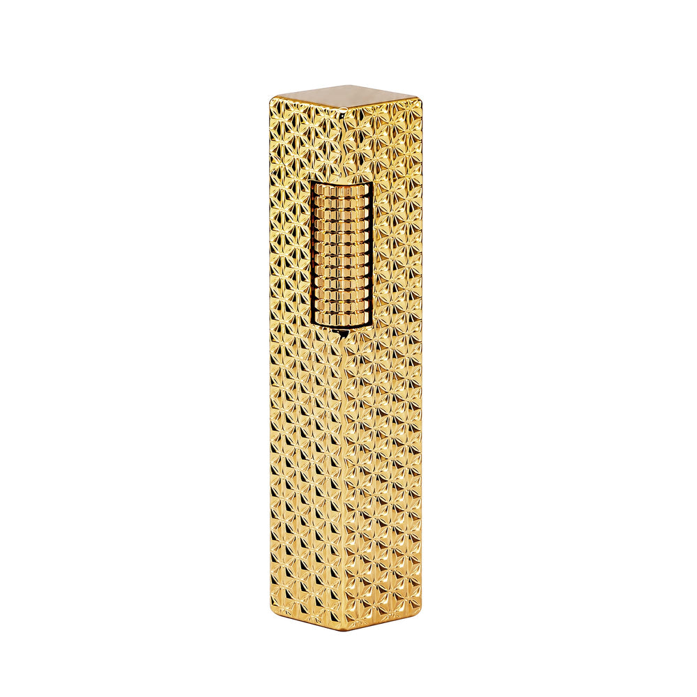 Thorens rectangular lighter with gold starburst pattern and extended roller shown closed, highlighting the engraved brass body and side-slide ignition wheel.