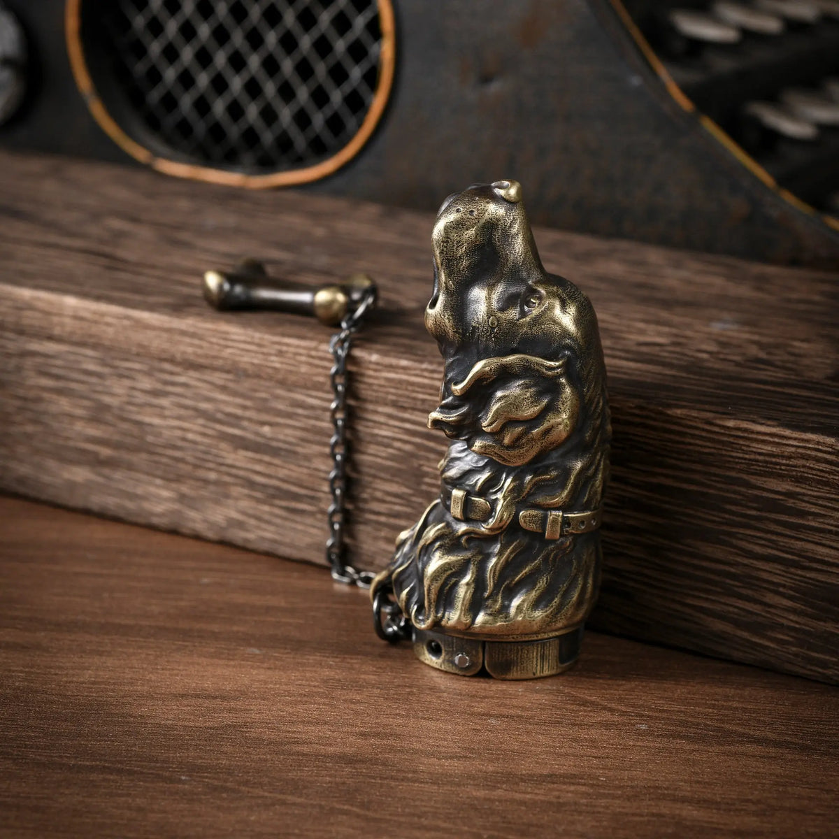 A vertical perspective of the Thorens Golden Retriever lighter, showing the antique brass dog head sculpture with detailed fur and collar, resting on wood.