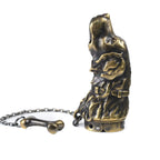 A Golden Retriever sculpted mechanical lighter with an antique brass finish and bone-shaped chain accessory, highlighting heritage brass craftsmanship and collectible appeal.