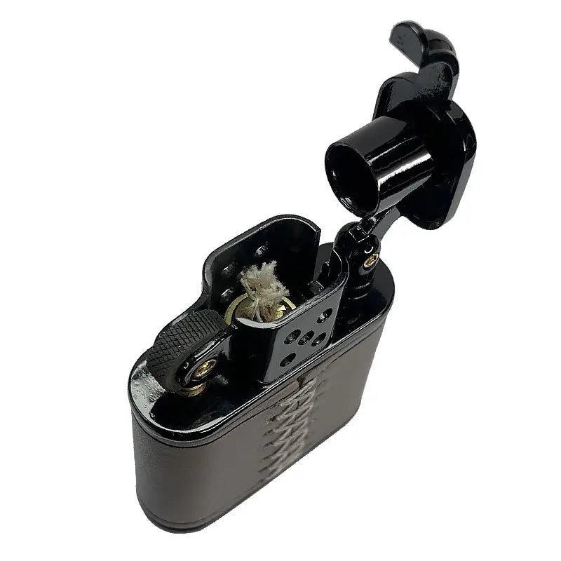 A top-down view of an open gray Thorens cowhide lighter, revealing the cotton wick, windproof chimney, and precision flint wheel.