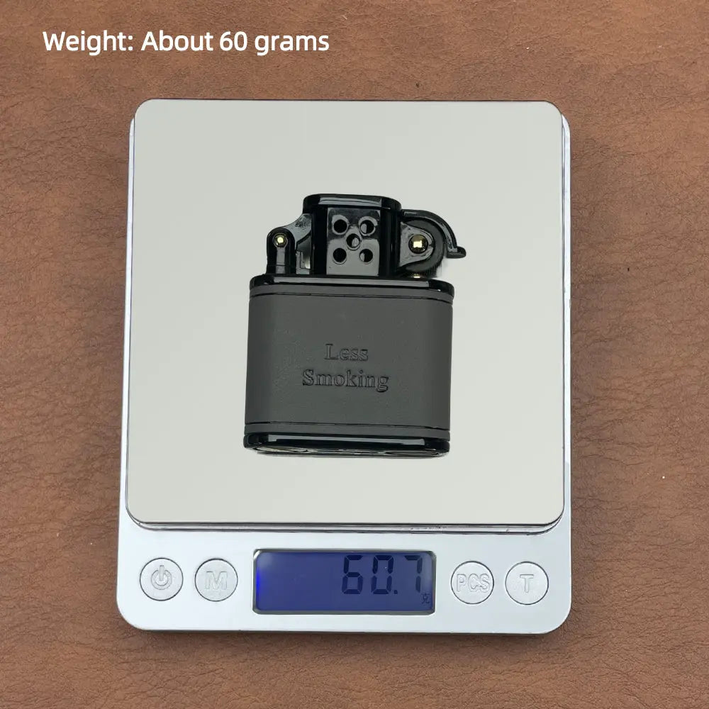 A Thorens gray handmade cowhide lighter sits on a silver digital scale displaying 60.7 grams, showcasing its lightweight and compact EDC design.