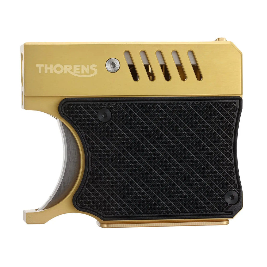 A unique Thorens lighter shaped like a pistol grip, featuring a brushed gold-toned chassis, a black textured rubberized grip panel, and slotted heat vents.