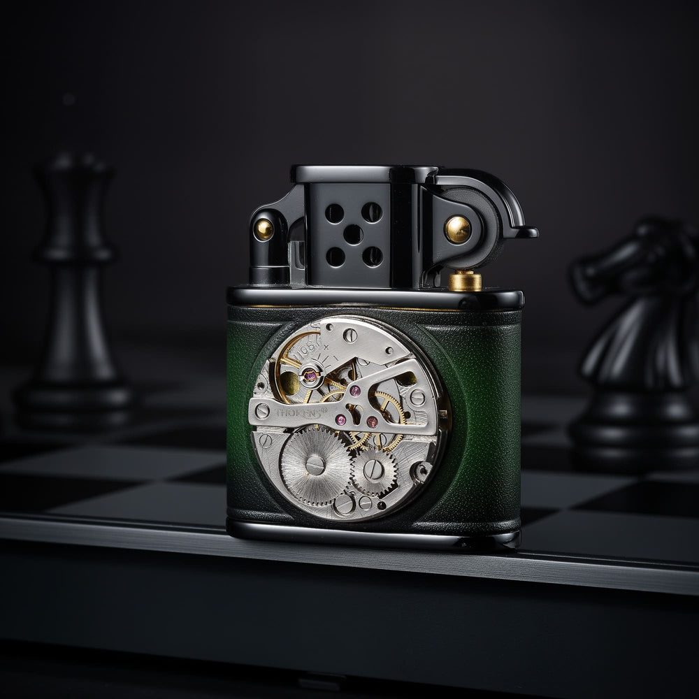 Thorens handmade cowhide lighter in green and black, shown upright with an inlaid mechanical movement dial and black metal top assembly.