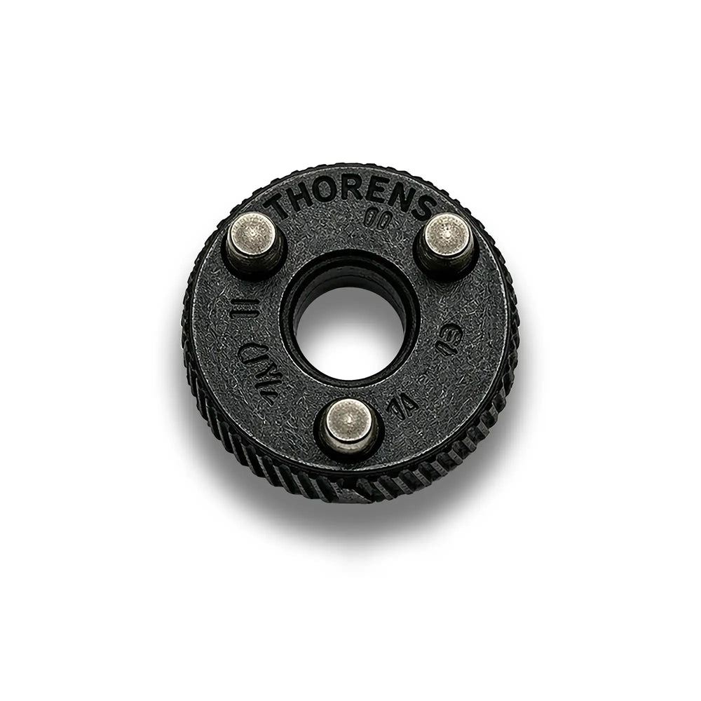 Close-up of a matte black Thorens flint wheel, highlighting the textured industrial finish and the precision mounting pins that ensure seamless engagement with the lighter's internal claw mechanism.