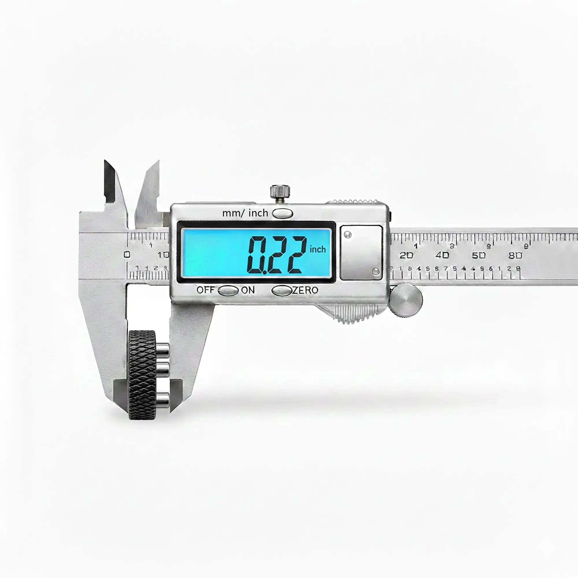 A digital caliper measuring a Thorens lighter flint wheel accessory, displaying a precise width of 0.22 inches, ensuring compatibility with single and double claw mechanical ignition systems.
