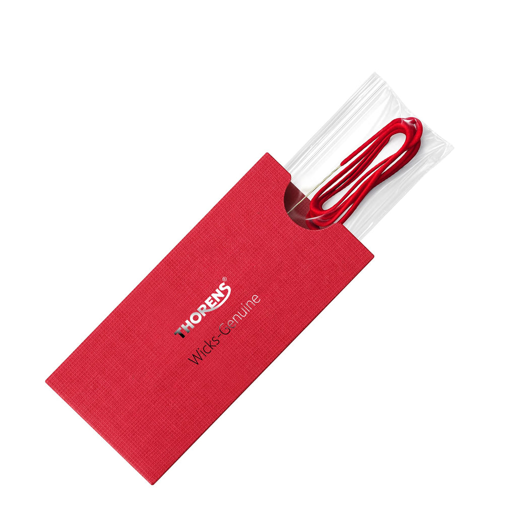 Thorens lighter wick replacement pack with red cotton wick stored in branded sleeve and clear protective cover on a clean background.