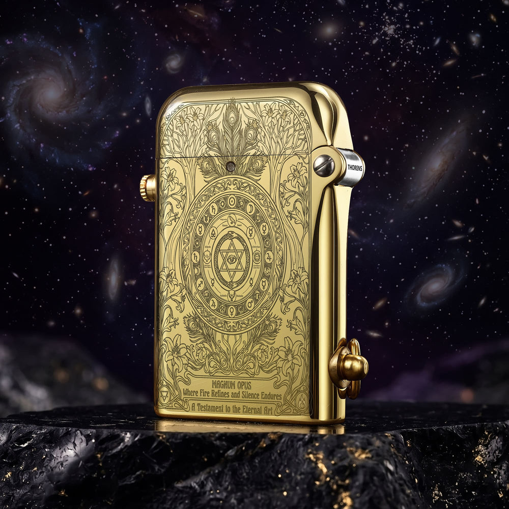 Thorens Magnum Opus lighter in engraved brass finish shown closed, highlighting detailed symmetrical engraving and polished edges against a dark cosmic background.