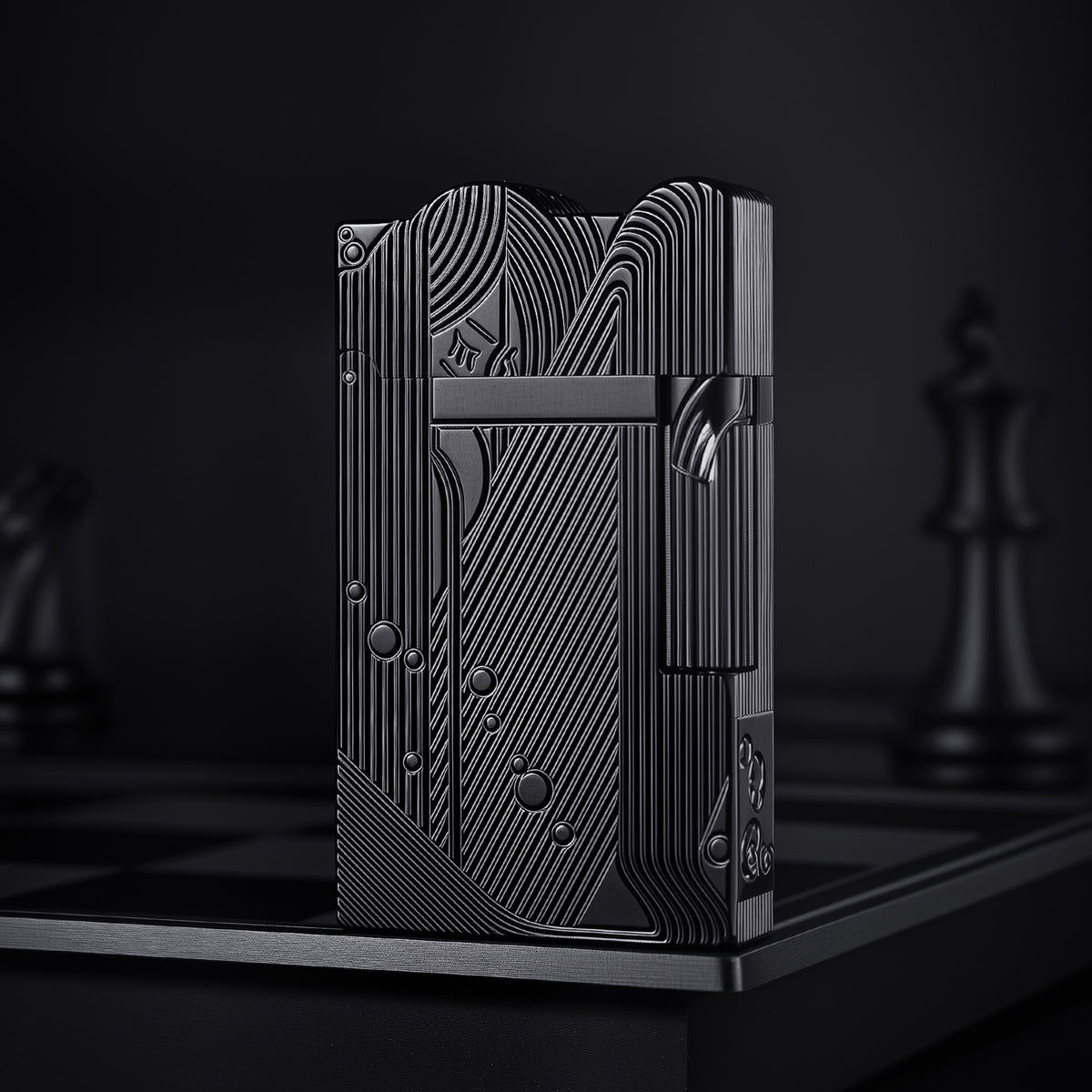 A sleek black Thorens Mermaid lighter resting on a monochrome chessboard, featuring intricate matte and polished linear engravings that form an Art Deco mermaid motif.