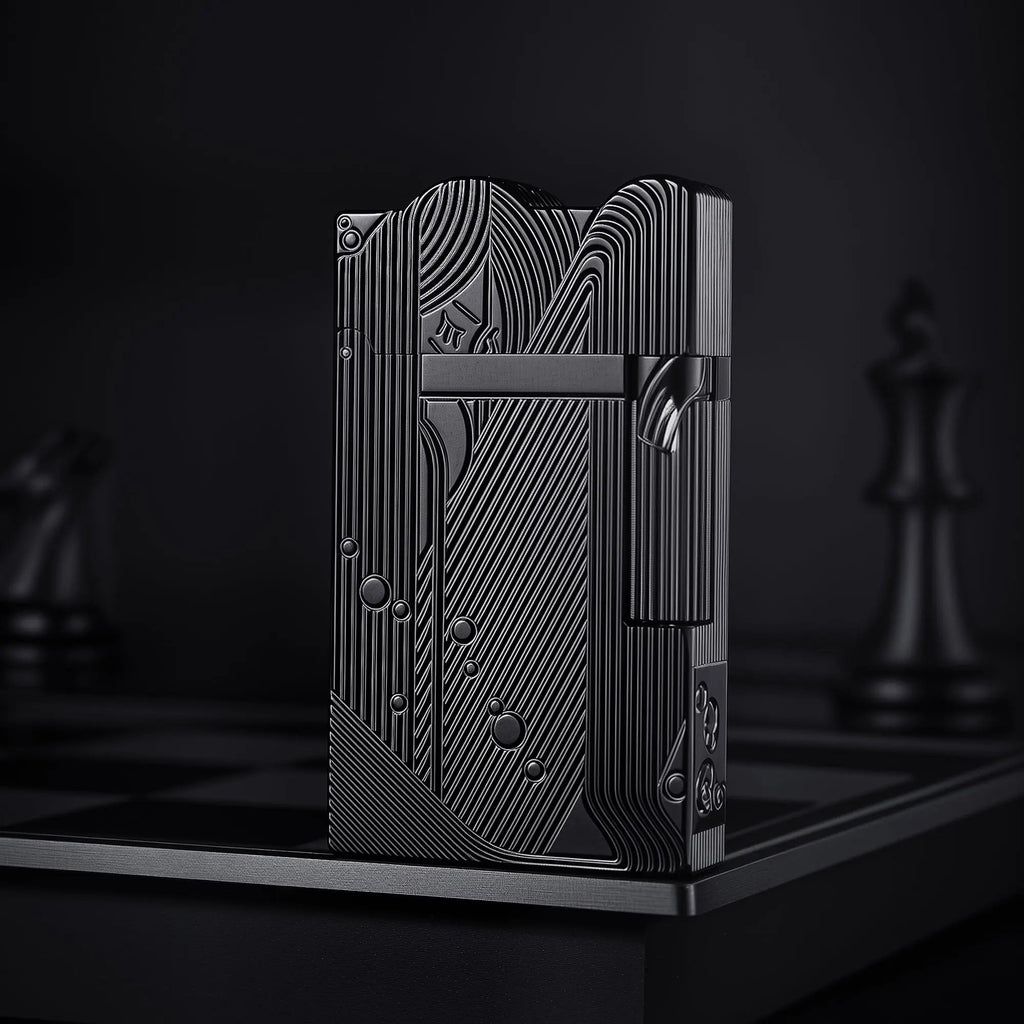 A front-facing view of the black Thorens Mermaid lighter, showcasing the deep-etched Art Deco mermaid motif and unique scalloped top against a dark, moody background.