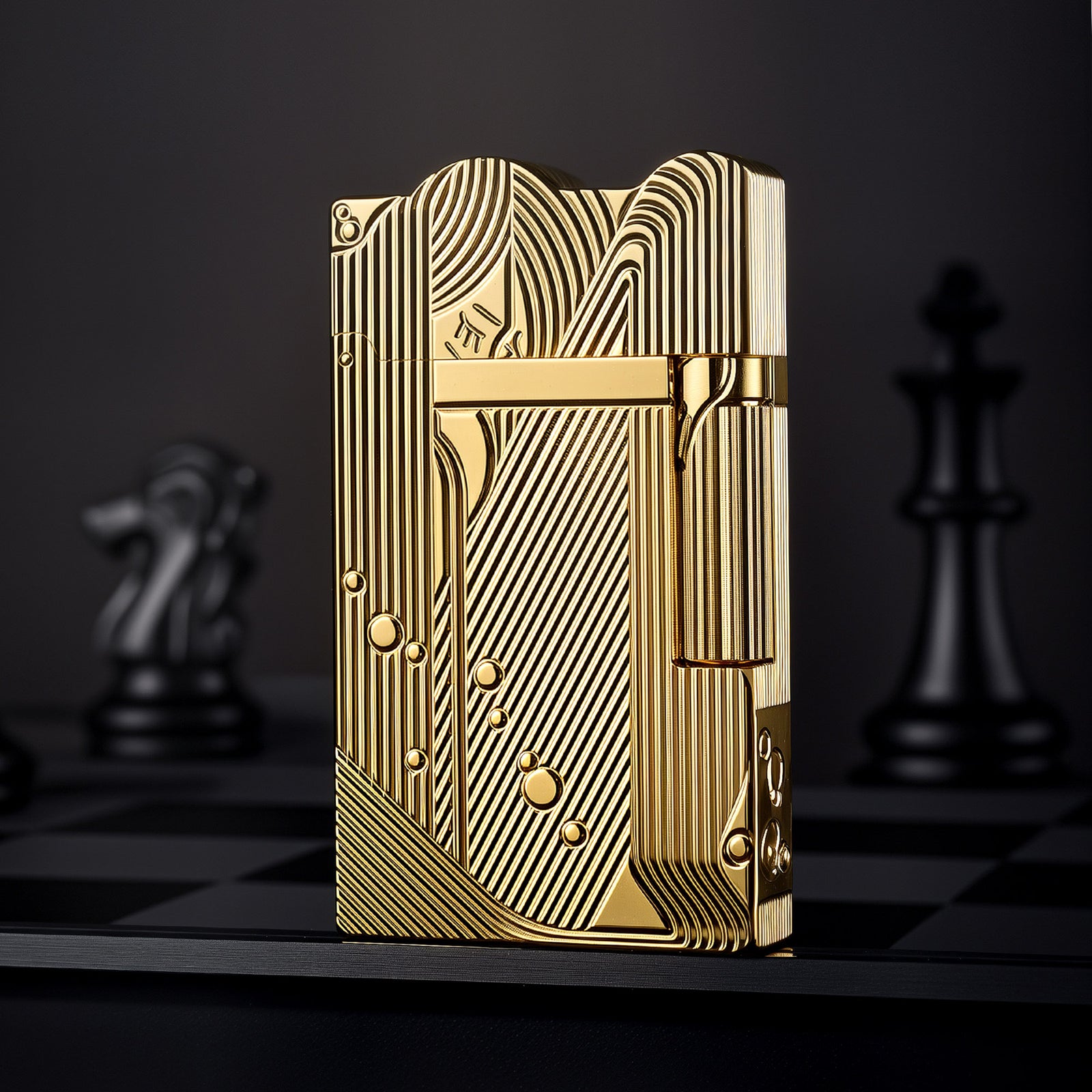 A stunning gold Thorens lighter featuring a highly detailed Art Deco mermaid engraving with flowing lines and bubble accents, set against a dramatic chess-themed background.