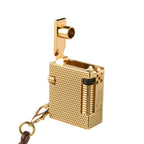 Close-up of a Mini Cube Golden Mesh lighter with the mechanical arm open, highlighting the textured brass finish and Swiss-inspired side engravings.