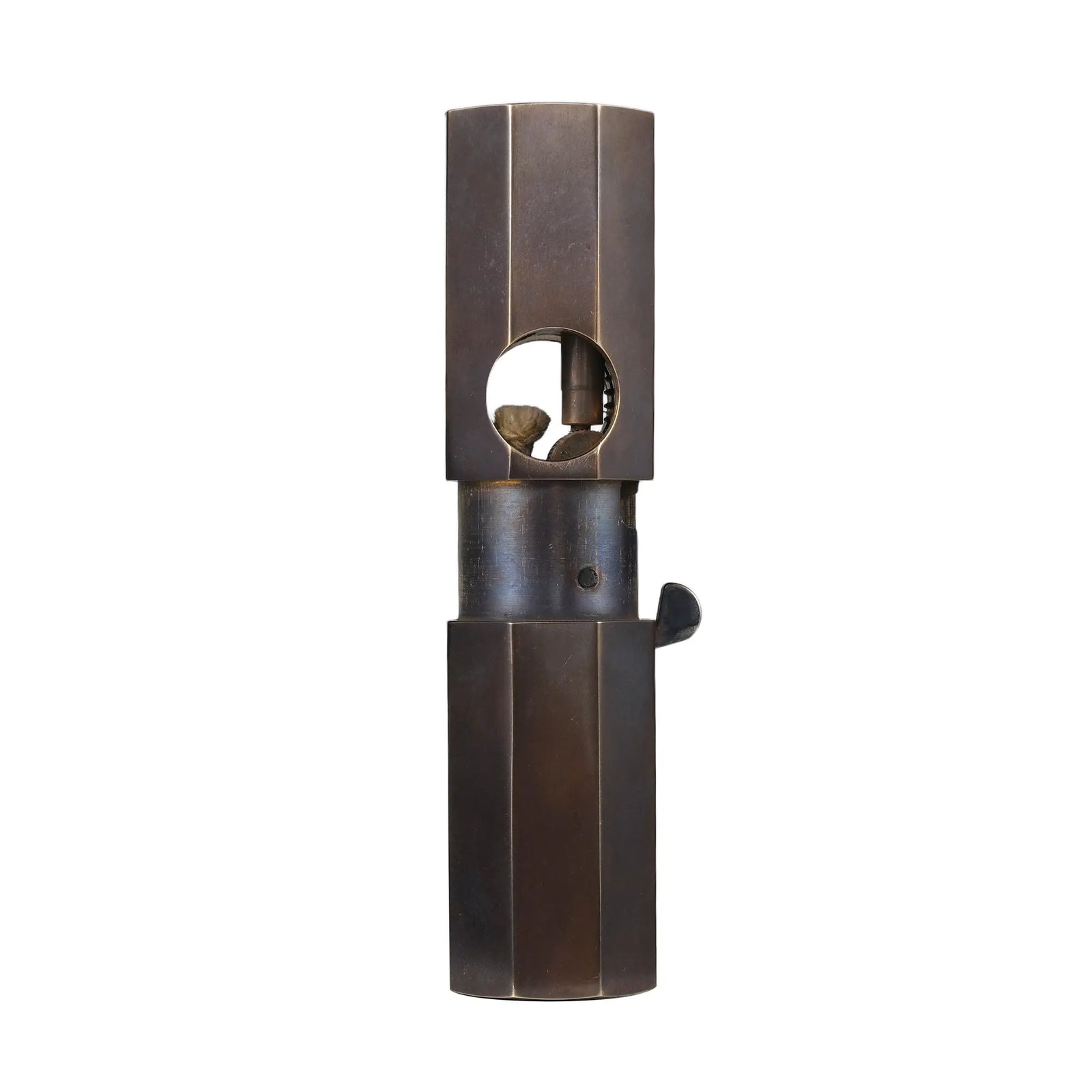 A studio front view of the Octagon Trigger Glossy lighter with the sleeve extended, revealing the internal brass ignition mechanism and cotton wick.