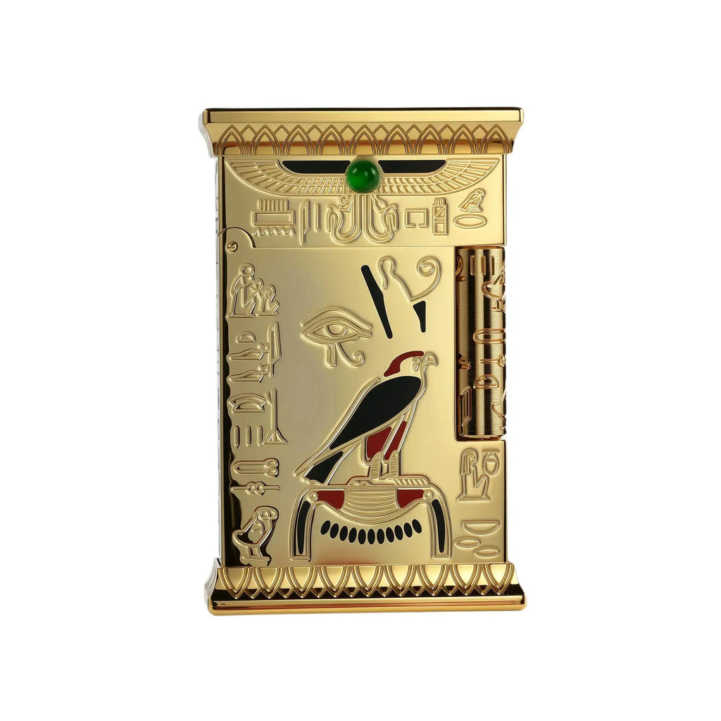 A gold-toned Pharaoh's Light lighter featuring embossed Egyptian hieroglyphics, a central falcon relief, and a green gemstone inlay against a white background.