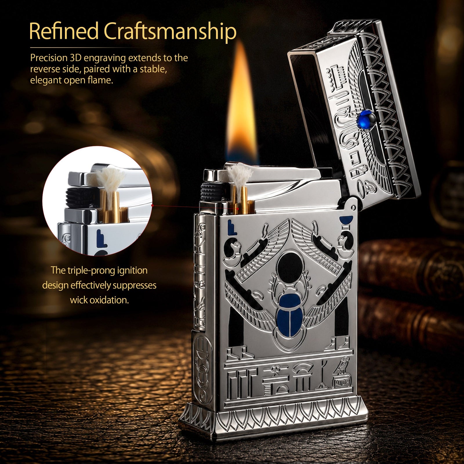 An open Pharaoh's Light Silver lighter ignited with a steady flame, showing a winged scarab engraving and blue gemstone on a metallic chrome body.