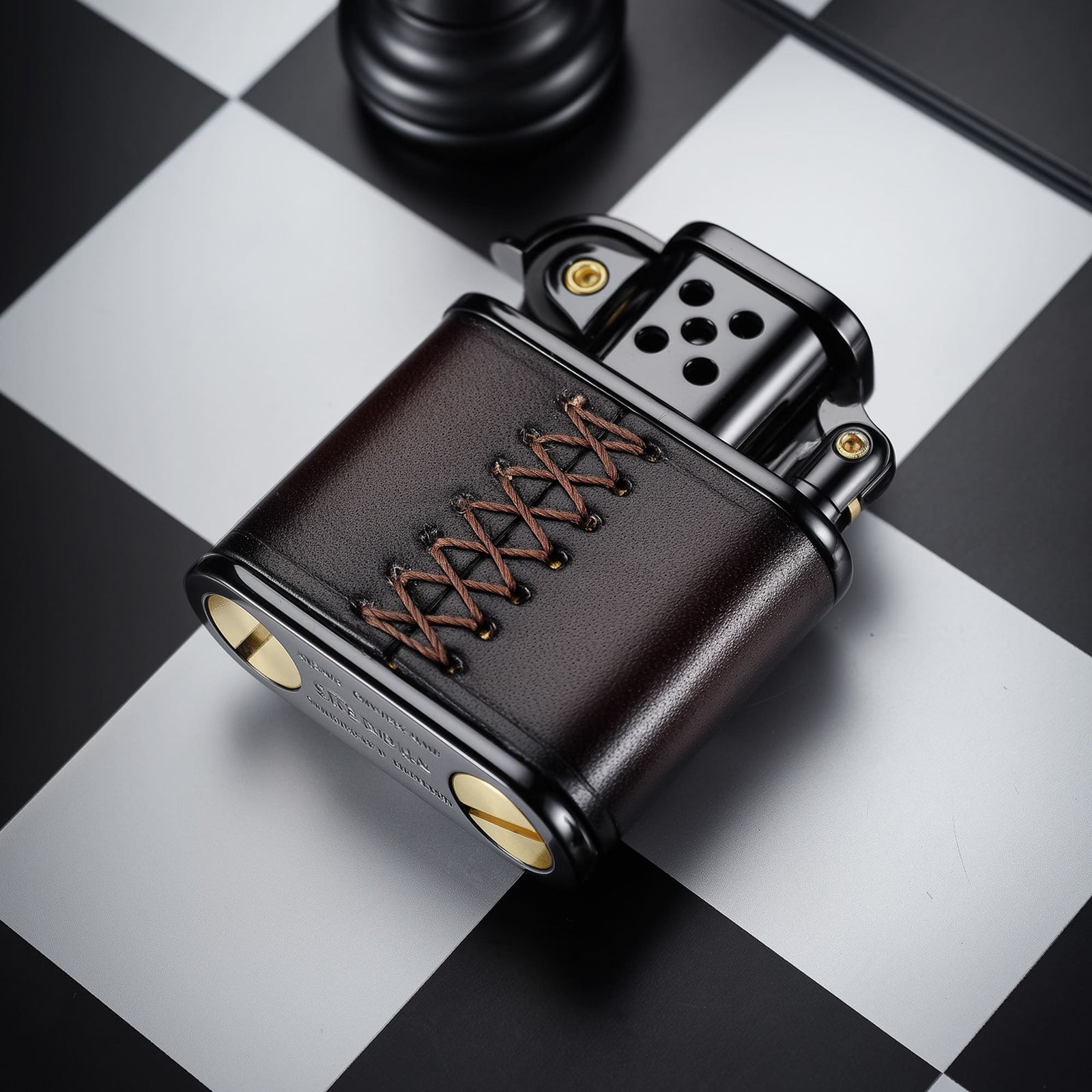 Back view of the THORENS handmade cowhide lighter with inlaid mechanical movement in red and black color, showing leather wrap and hand-stitched lace detail.