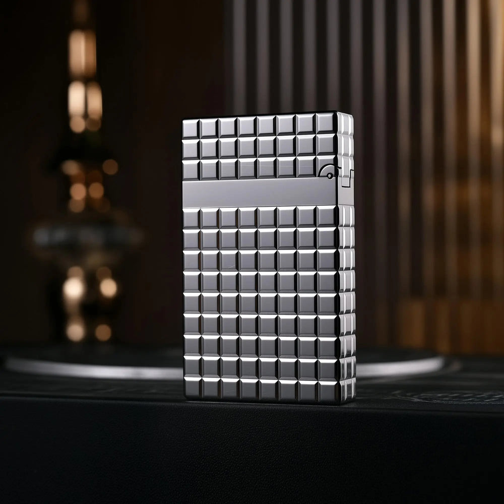 The reverse side of a silver Thorens side slip lighter, displaying the seamless argent block pattern and high-polish finish across the mechanical body.
