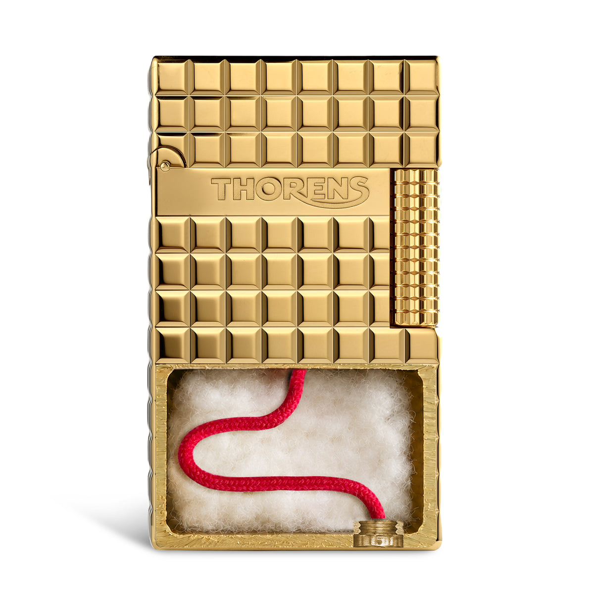 An ignited gold Thorens side slip lighter showing a steady flame and active sparks, highlighting the polished auric block texture and side roller.