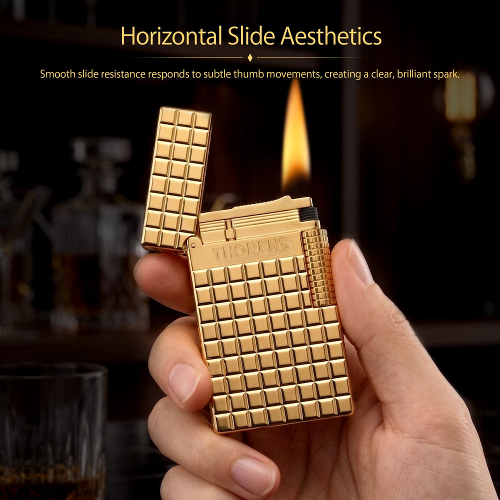 An open gold Thorens side slip lighter featuring a polished auric block pattern, a detailed view of the internal ignition mechanism, and a textured side roller.