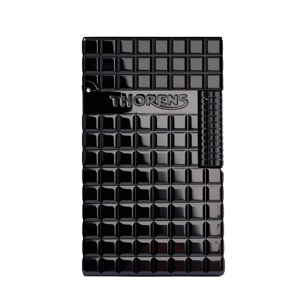 A Thorens Side Slip lighter featuring a deep onyx black block grid pattern, an embossed Thorens logo, and a matching textured ignition roller.