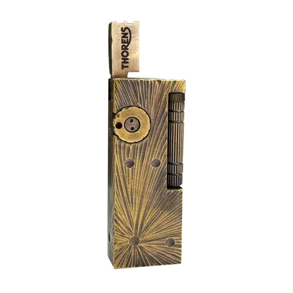 A Thorens Side Slip lighter featuring the unique Meteorite Crater texture on an antique brass body, highlighting the rugged mechanical design and collectible heritage appeal.