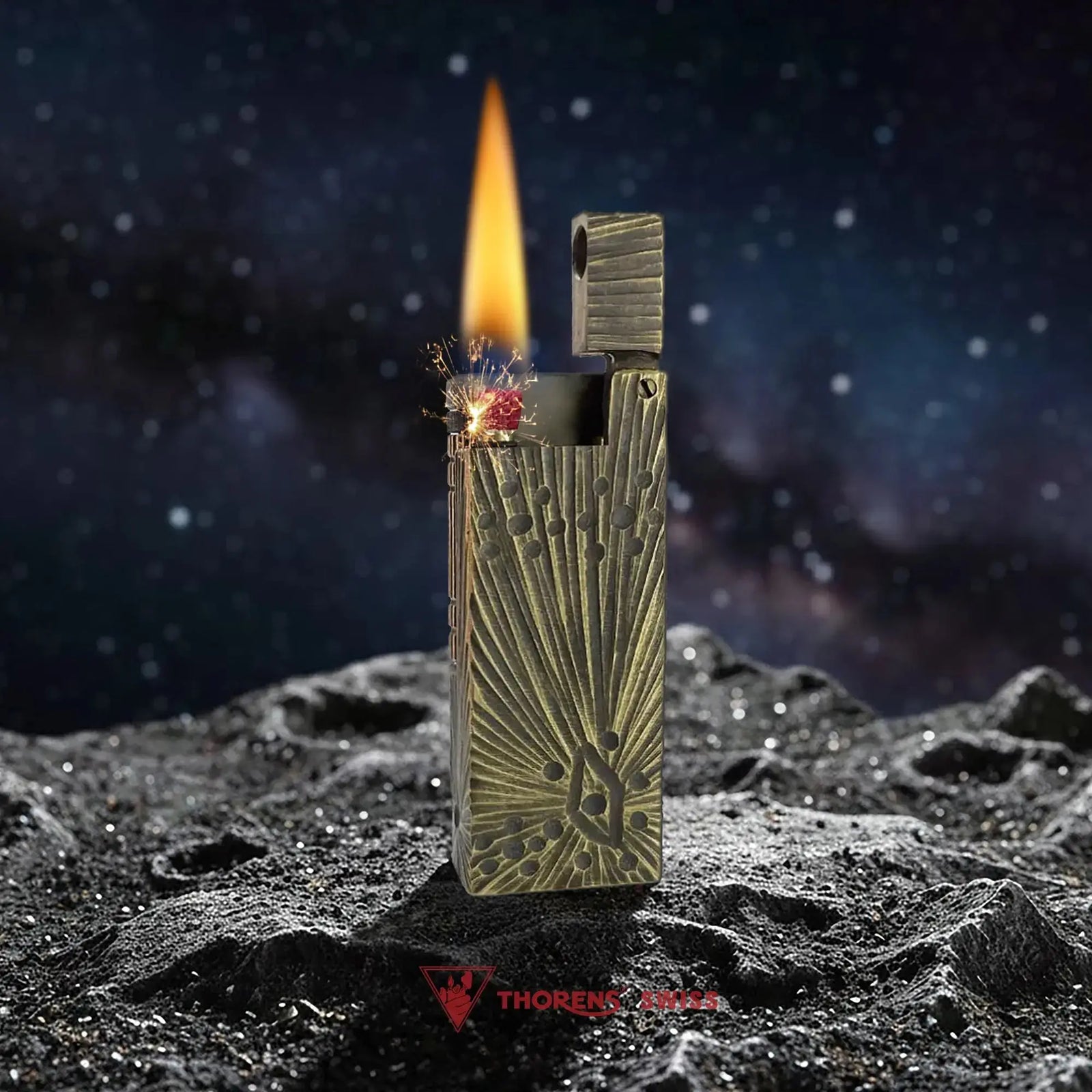 An ignited Thorens Side Slip lighter with the Meteorite Crater antique brass finish, displaying a vibrant flame and mechanical sparks against a celestial lunar backdrop.