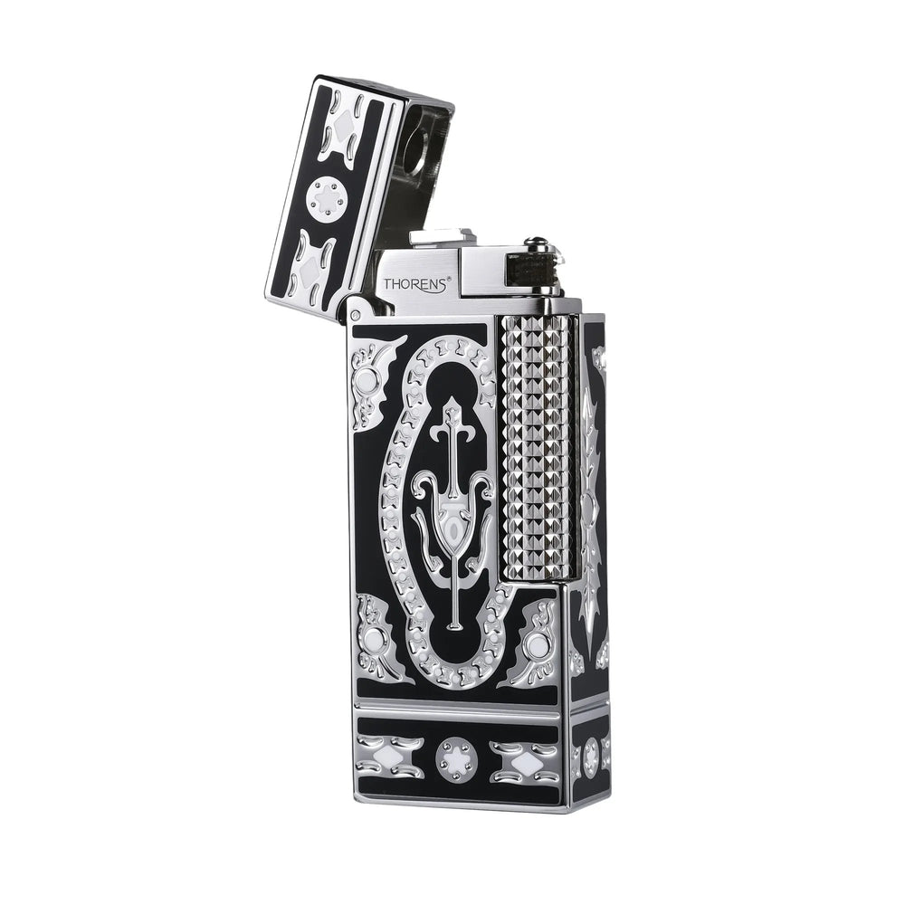 An open Side Slip narrow lighter featuring the Holy Grail Black design with intricate silver baroque engravings against a deep black finish and a polished silver hobnail roller.