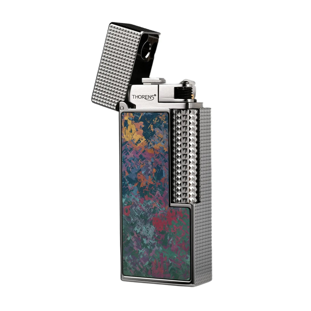 An open Side Slip narrow lighter showcasing its vibrant Iridescent Ti titanium inlay with pink, green, and gold hues, set against a polished silver-toned hobnail body.