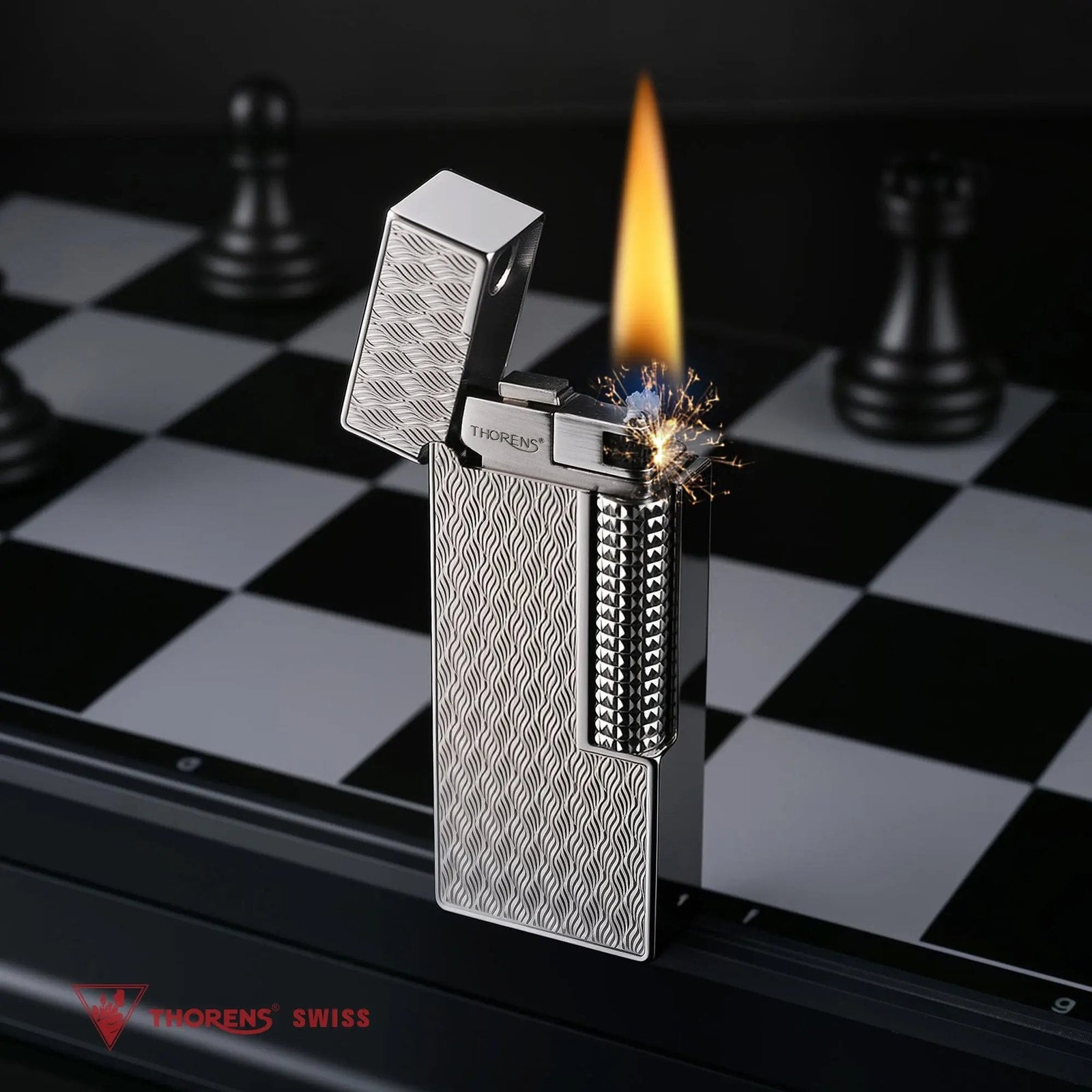 An open Ripple Shadow narrow lighter in mid-ignition, throwing bright sparks and a steady flame, set against a dark chessboard with blurred chess pieces.