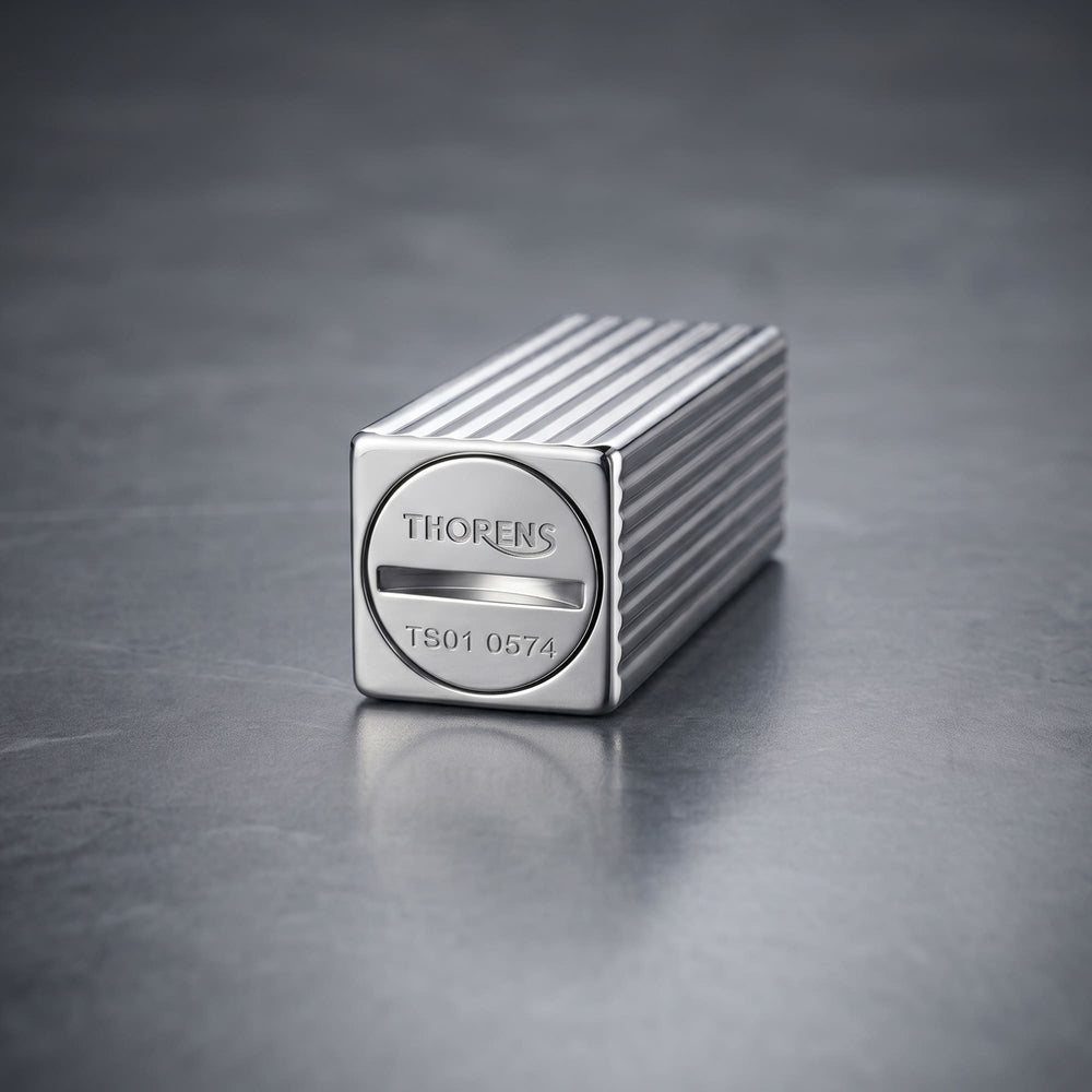 Thorens Side Slip rectangular lighter in silver pinstripe finish focused on the base, showing engraved logo and refill slot with clean linear brass construction.