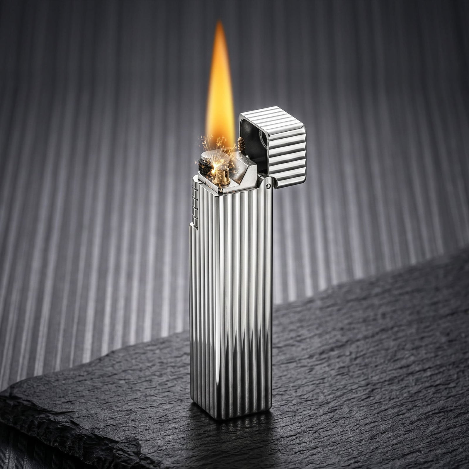 Thorens Side Slip rectangular lighter in silver pinstripe finish igniting with flame and spark, lid open to reveal flint wheel, wick, and precision brass mechanism.