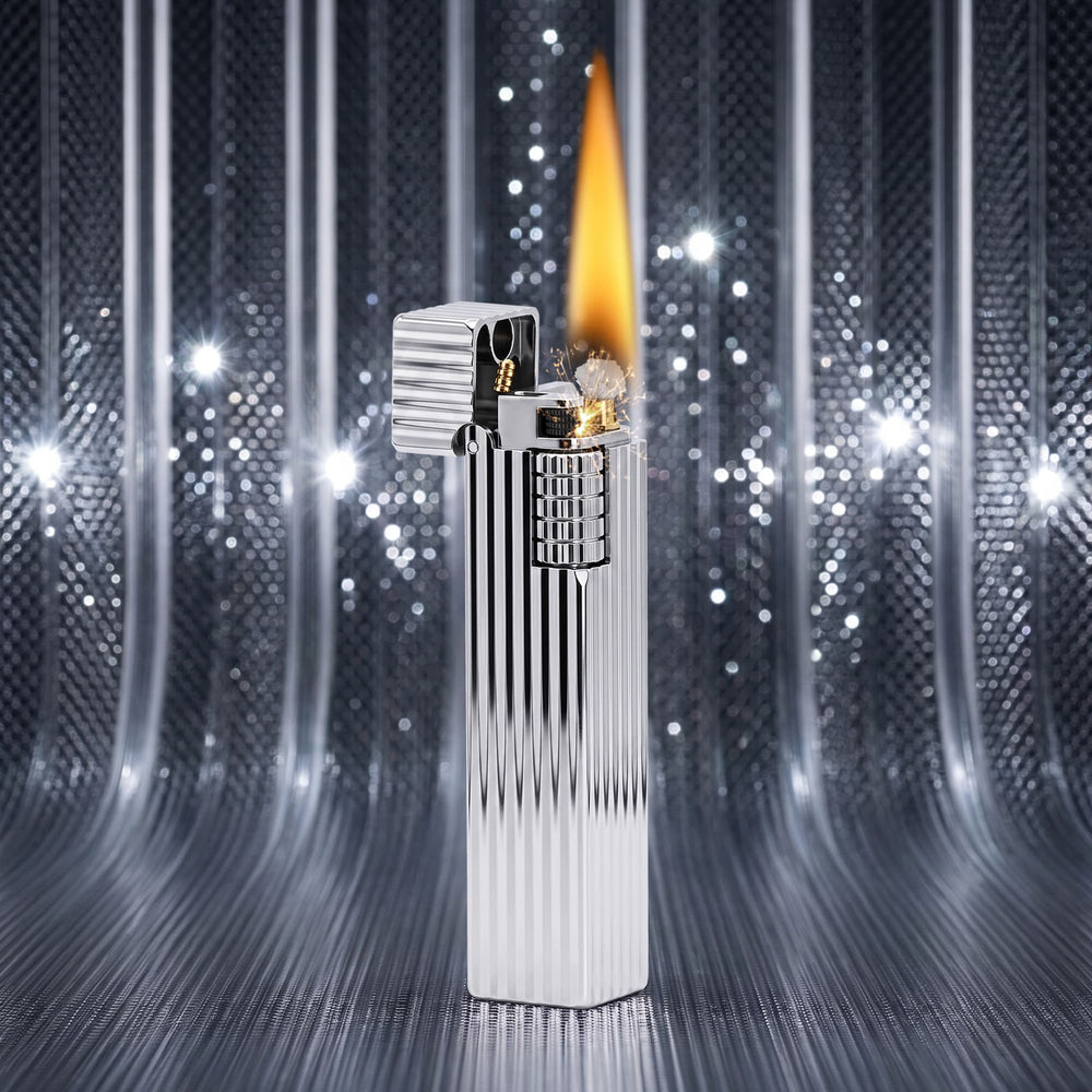 Thorens Side Slip rectangular lighter in silver pinstripe finish igniting with flame and spark, lid open to reveal flint wheel and wick against a reflective metallic backdrop.