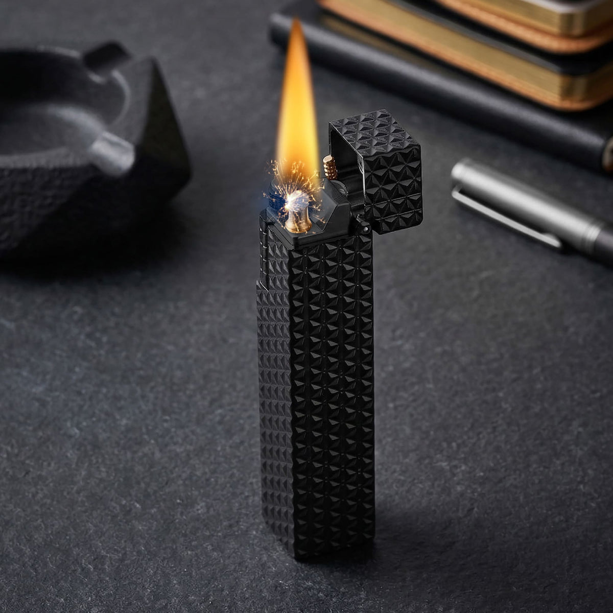 Thorens Side Slip rectangular lighter in black starburst pattern igniting with visible spark and flame, lid open to reveal precision ignition mechanism.
